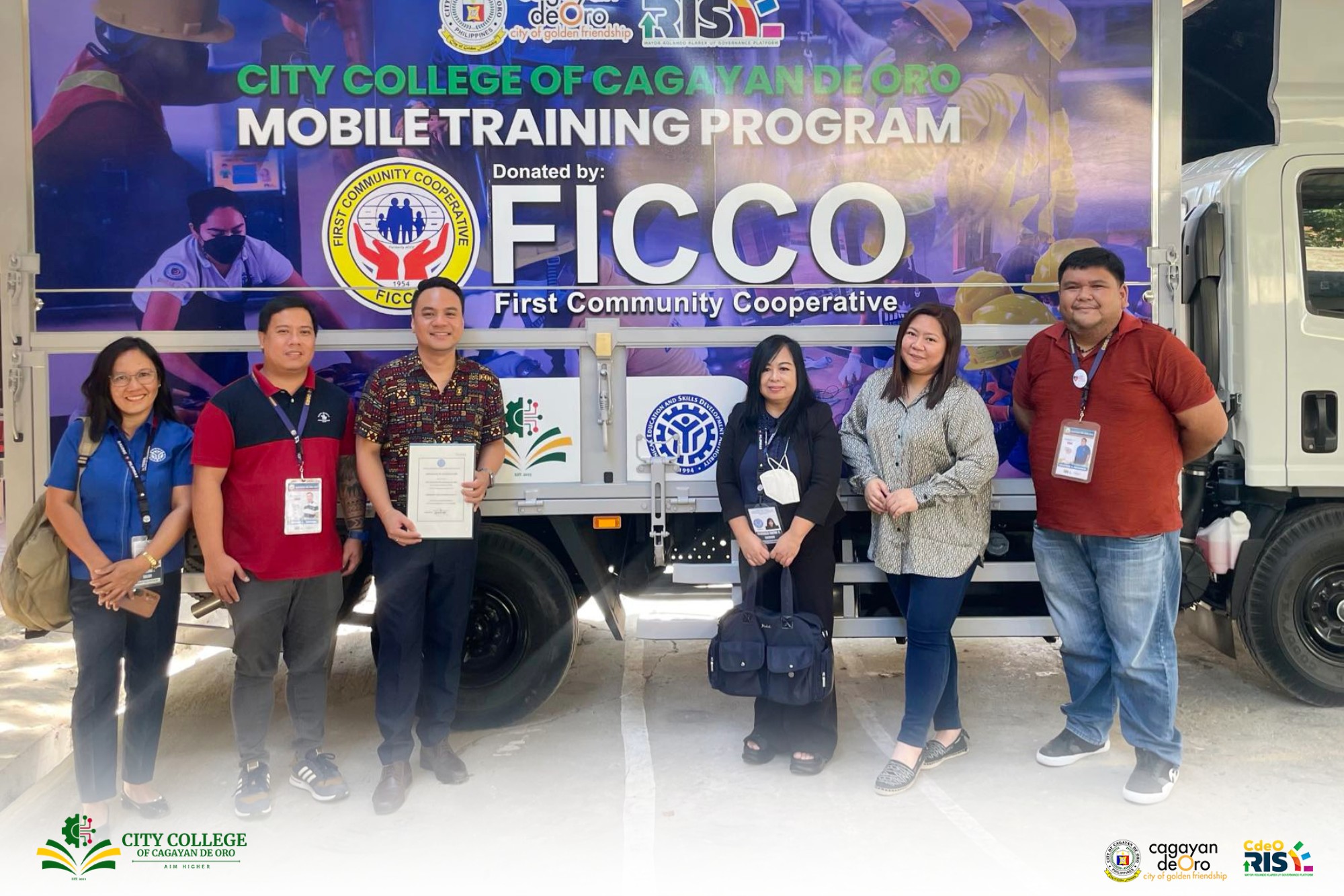 City College of CDO staff receiving accreditation from TESDA Region 10 officials